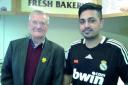 Satbir Sandhu of Ewell Bakery with regular customer and friend Gordon Tidbury