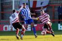 Tough tackle: Ks skipper Gary MacDonald puts the boot in during Saturday's 2-0 defeat to AFC Hornchurch at Kingsmeadow
