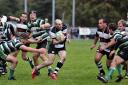 Coming through: Mike Cartledge moves through the Tottonians defence