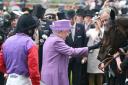 Queen Elizabeth II pats her horse Estimate after it won the 2013 Gold Cup ridden by jockey Ryan Moore