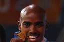 Mo-mentous: Farah with his gold medal Stu Forster/Getty Images