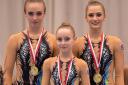 Golden girls: RGA's Tabbie Dawson, Kitty Williams and Scarlett Wright with their Flanders International Acro Cup gold medals