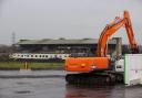 Contractors with excavators have begun clearing the concrete seating terraces at GAA stadium in Belfast, Northern Ireland, ahead of the long-delayed redevelopment of the stadium. The maintenance and pre-enabling works will run until April, when the