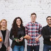 The Oddbox team holding 'wonky' fruit and veg