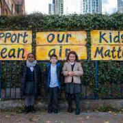 The children and artist in front of their work outside Wyvil Primary School