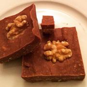 Celia’s delicious raw fudge brownies garnished with walnut