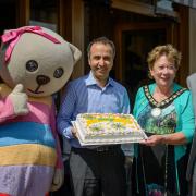 Celebration cake: Alice the Bear, Reza Amini, Councillor Jan Fuller and husband John Fuller
