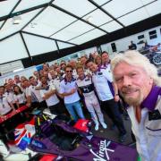 Selfie: Virgin boss Richard Branson and his team, with Sam Bird central in the black and white top                    Photographer / Spacesuit Media