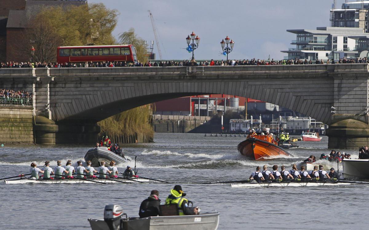 In the womens race Cambridge (left) almost fell victim to the choppy conditions and Oxford won