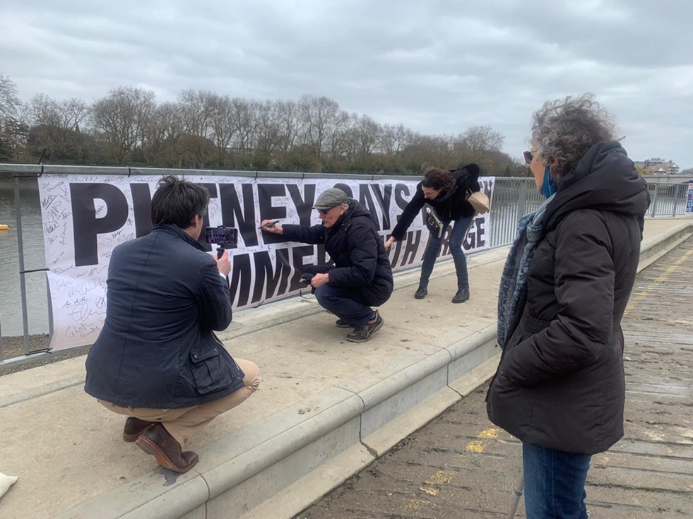 Protestors sign Hammersmith Bridge banner