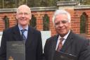 Happier times: Cllr Mirza and Mr Munro together at the opening of the Muslim Burial Ground Peace Garden in Woking in November 2015