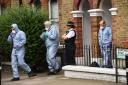 Forensics and a police officer outside a property on Grayshott Road in Battersea, south-west London. A 40-year-old man has been arrested on suspicion of murder after a woman was found fatally stabbed, Scotland Yard has said. PRESS ASSOCIATION Photo. Pictu