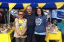 Celebrating: Djulsa Whelan, Tony Burley and Stella Hayes of the Epsom and Ewell fundraising group