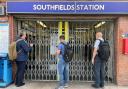 Passengers wait for the entrance gates to open at Southfields underground station in south London, the day after members of the Rail, Maritime and Transport union (RMT) from 14 train operators went on strike over jobs, pay and conditions / Image: PA
