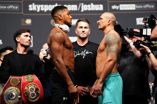 Anthony Joshua (left) and Oleksandr Usyk during a weigh in at The O2 London. Credit: PA