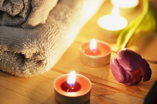 Wandsworth Times: A pile of towels, candles and a tulip. Credit: Canva