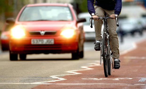 Wandsworth Times: Photo via PA shows a cyclist on the road near traffic.