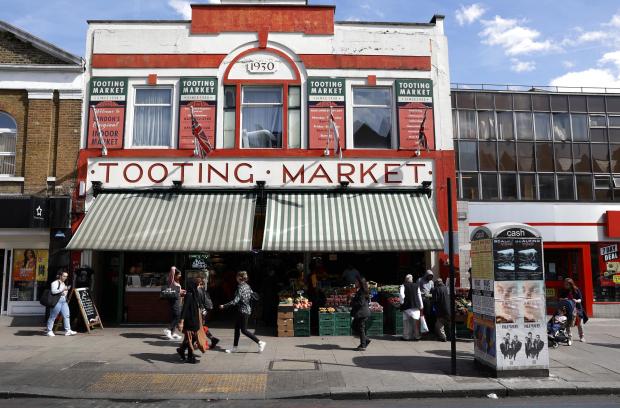 Wandsworth Times: Londoners walk past Tooting market in London, Britain 19 May 2022 (photo: Facundo Arrizabalaga/MyLondon)