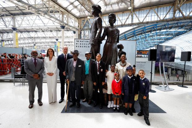 Wandsworth Times: The Duke and Duchess of Cambridge, accompanied by Baroness Floella Benjamin, Windrush passengers Alford Gardner and John Richards and children at the unveiling of the National Windrush Monument at Waterloo Station, to mark Windrush Day