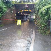 A flooded road in south London after heavy rainfall. ( @DanHolden85 )