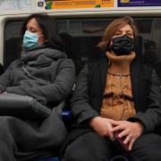 People wearing masks traveling on the London Underground. Image: Stefan Rousseau/PA