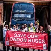 People standing in front of a number 74 bus. (photo: Joanne Harris from Putney Bus Garage)