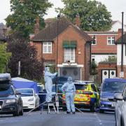 Forensics officers at the scene in Kirkstall Gardens, Streatham Hill, south London, where a man was shot by armed officers from the Metropolitan Police following a pursuit on Monday evening
