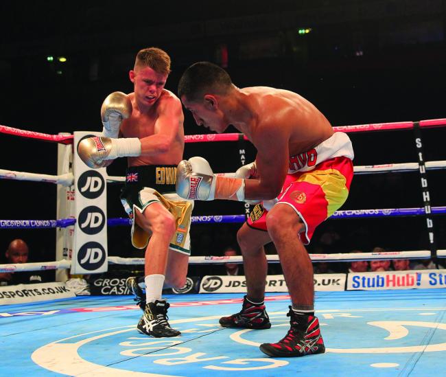 World title talk: Charlie Edwards, left, in action earlier in his  pro boxing career				 Pic: Lawrence Lustig