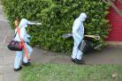 Police forensics at a property on Darell Road in Kew. © PA